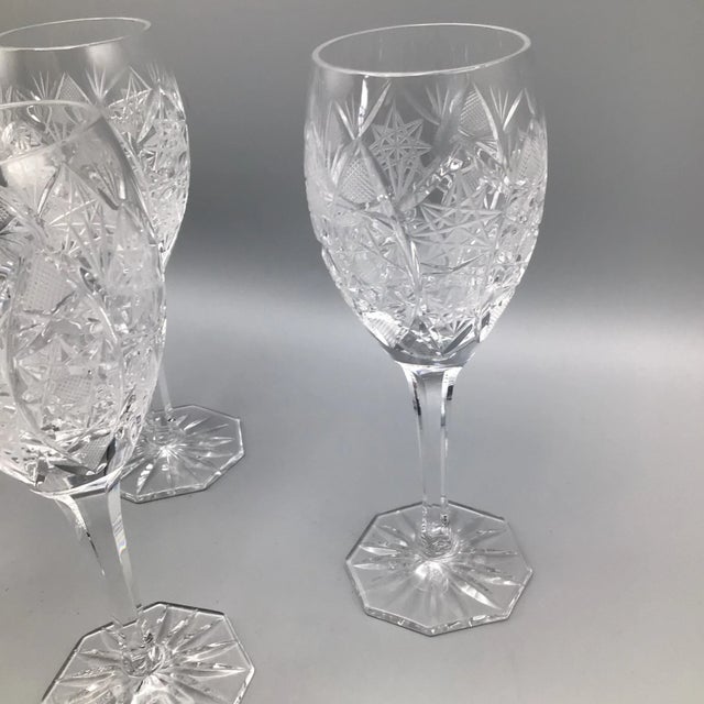 What a beautiful set of crystal deep cut star pattern wine glasses with a octagonal stem and octagonal foot. Although they...