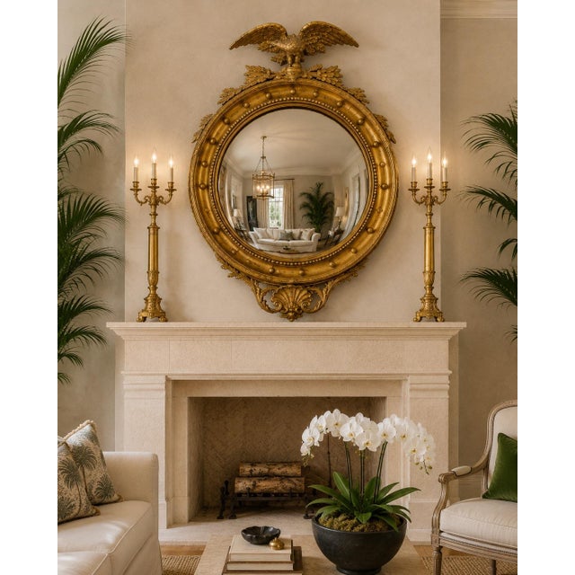 Large-scale and highly dimensional Federal-style convex wall mirror featuring a boldly carved spread-wing eagle crest...