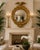 Large-scale and highly dimensional Federal-style convex wall mirror featuring a boldly carved spread-wing eagle crest...