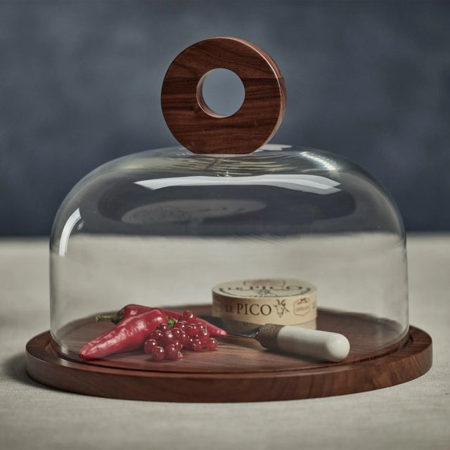 This Walnut Wood Cheese Board with Glass Cloche is a simple and sleek way to present your cheese selection. The walnut...