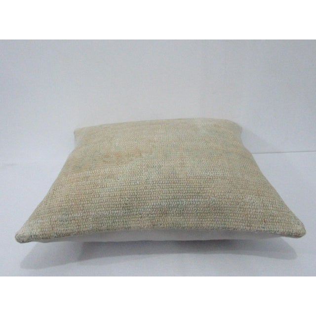 Decorative pillow cover made from a vintage Turkish handknotted rug. Backed with good quality cotton fabric. Pillow...