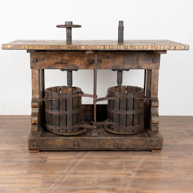 This exceptional wine tasting table or standing bar table was creating using an antique double wine press from Hungary...