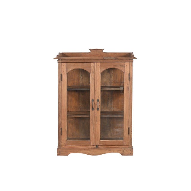 This Vintage Anglo-Indian Teakwood Small Bookcase is constructed from solid teakwood, featuring glass-paneled sides and...