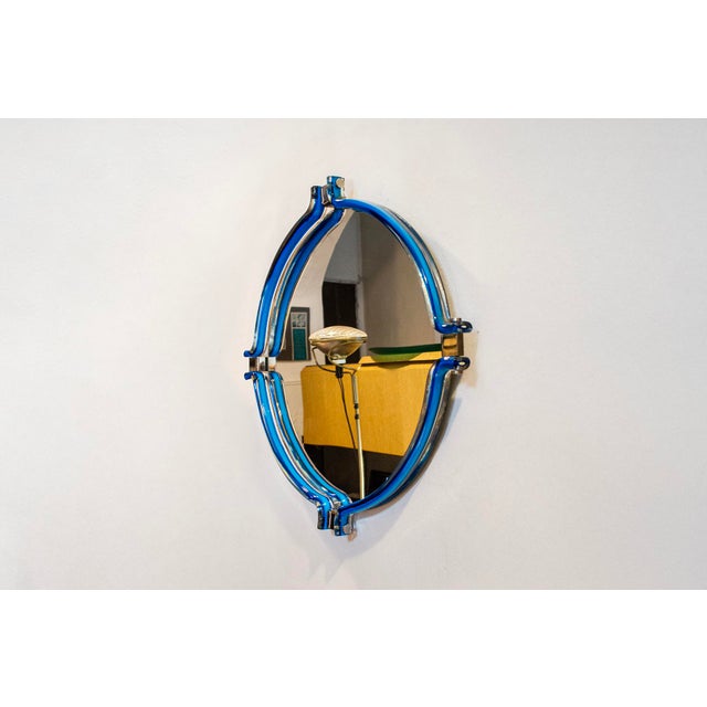 Mirror with chromed metal frame and sculptural Murano glass frame. Made in Italy 1970s