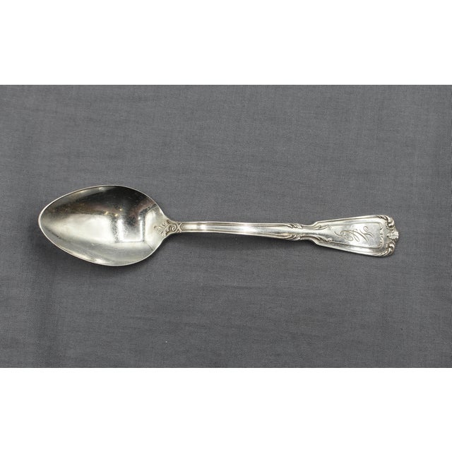 Set of 12 sterling silver teaspoons, Chambord 1909 pattern by Reed & Barton. Monogram "MC". 7.60 troy oz. 5 5/8" x 1 3/16"...
