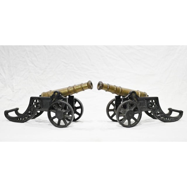 Pair of collectable antique cannons we date to circa 1920. Made from cast iron with gunmetal barrels Great decorative pair...