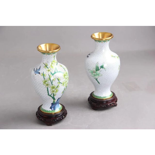 Two beautiful Chinese Jingfa vases on wooden bases. The height of each vase without the base is 20.5 cm. The vases are in...