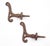 Antique Art Nouveau style wall hooks made of cast iron with a rusted black finish. They feature pointed wood screws on the...