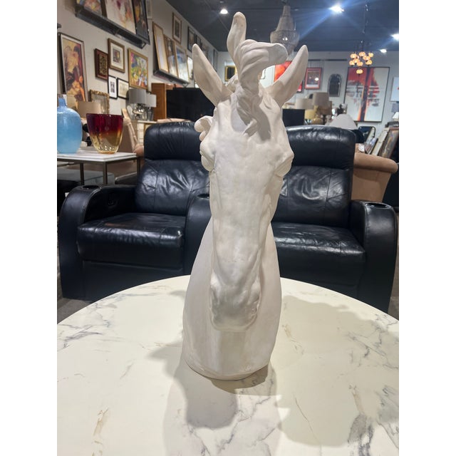 This elegant decorative horse head sculpture is rendered in a crisp white finish, capturing the noble profile and...