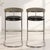 Vintage 1980s tall bar stools. Continuous tubular chrome frame provides a sleek silhouette and subtle springiness. Black...