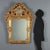 Eclectic mirror in carved and gilded wood. Molded frame with engraved and carved inserts. Openwork cornice, richly carved...