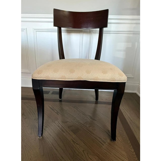 A subtle nod to Old Hollywood with clean lines and dramatic appeal, this side chair seamlessly complements a variety of...
