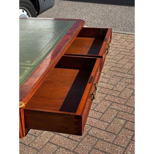 Regency Style Desk with Green Leather Top The desk has dummy drawers to the rear so could be used in the centre of the...