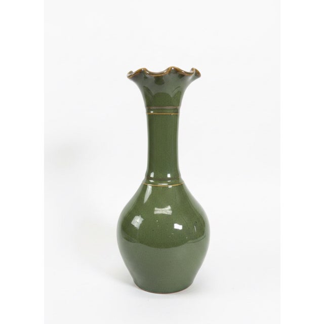 Hand-thrown studio pottery vase by North Carolina potter Matthew Nance. This distinctive vessel features a rich green...