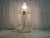 This 1990s Murano glass table lamp features a classic and timeless design, characterized by clean, flowing lines and a...