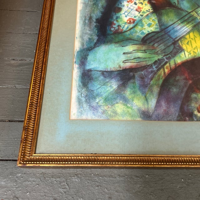 1960’s original yehuda vardi lithograph of a girl playing a guitar. Signed and framed. Overall measures 25.25x31.25....
