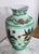 Vase with generous belly and flared mouth, carrying the mark of Limoges porcelains on the bottom. It is decorated with...