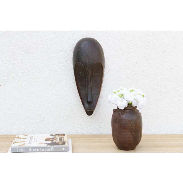 This elegant Fang Ngil mask from Gabon is a captivating example of African tribal art. The mask is characterized by its...