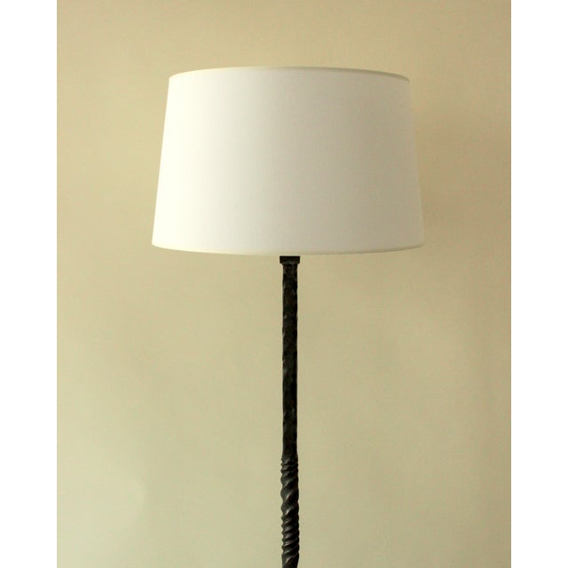 Wrought iron floor lamp in the style of the Marolles artisans. High-quality French ironwork from the 1950s/60s. This...