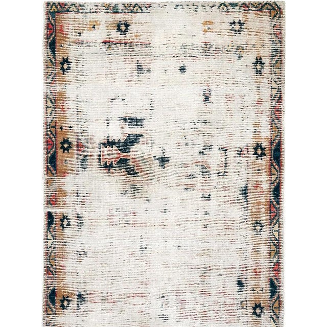 A weather-textured distressed early 20th century Persian Heriz Runner