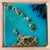 This artwork captures a vibrant aerial view of a coastal landscape, where layered tinted resin creates a dynamic interplay...
