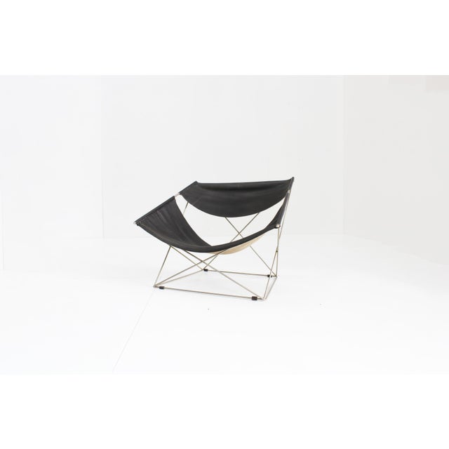 Artifort F675 Butterfly lounge chair designed by Pierre Paulin. This design classic from 1963 has black leather and...
