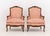 Pair of Louis XV Style Red and White Fabric Upholstered Walnut Bergeres, each with carved floral motif cresting and...