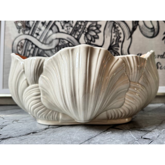 Gorgeous, delicate cast porcelain cachepot in multi-scallop design. Soft white exterior with a lovely peachy interior...
