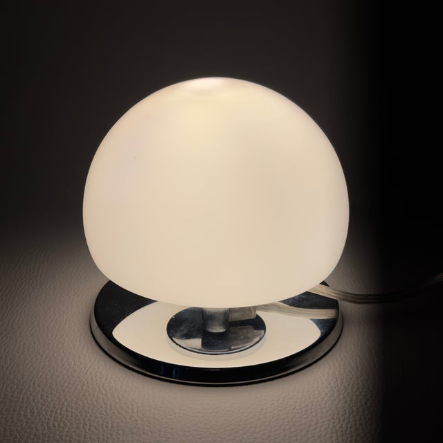 A delightful and innovative piece of lighting with a retro-futuristic allure. This compact table lamp, dating back to the...