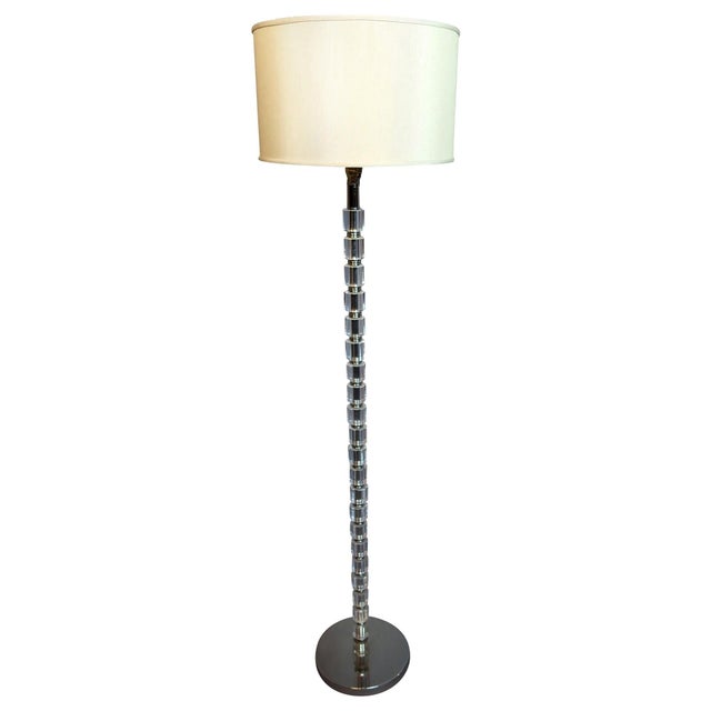 Crystal floor lamp with faceted glass pole and chrome base, contemporary styling with an off white linen drum shade....