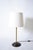Brass and wood viennese secession lamp, 1910s. Viennese secession table lamp resting on a wooden base, with an ornamental...