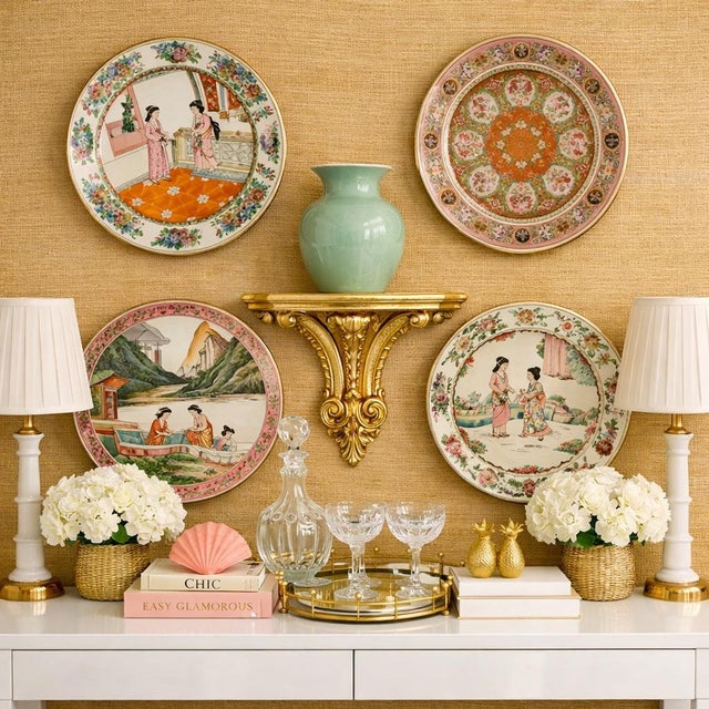 A beautifully curated set of four unique vintage Chinese famille rose chinoiserie plates, each measuring approximately...