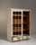 A tall vitrine featuring a softly aged white patina that enhances its decorative charm. The glazed doors allow for...