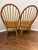 Bring timeless warmth and craftsmanship to your home with this handsome pair of vintage solid wood hoop-back Windsor...