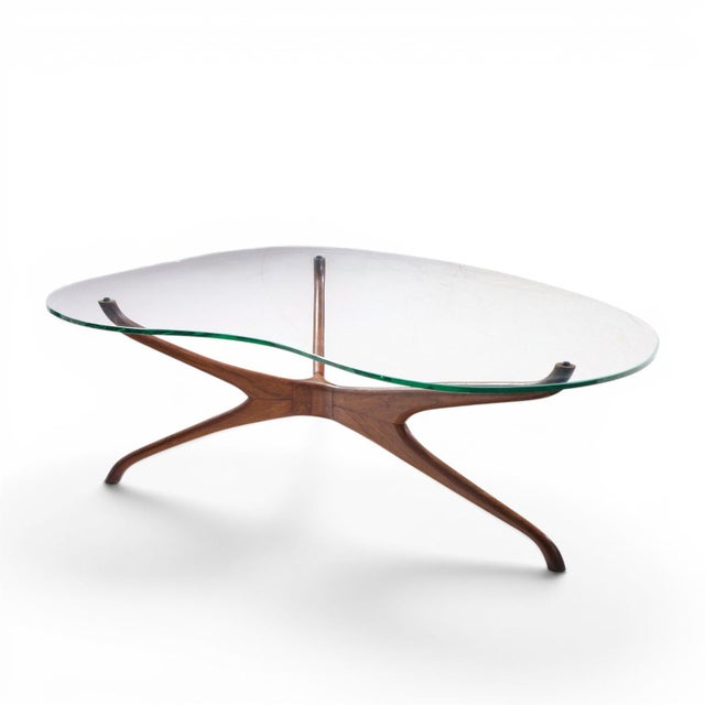 Vladimir Kagan for Dreyfuss Mid Century Walnut Tri-Symmetric Coffee Table This coffee table measures: 47 wide x 34.5 deep...