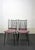 Set of four French dining chairs from the 1950s, design attributed to Colette Gueden. Black lacquered metal frame and...