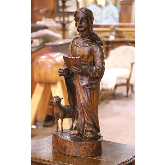 This evocative sculpture, hand-carved in France circa 1780 from solid walnut, depicts Saint John the Baptist, shown in...