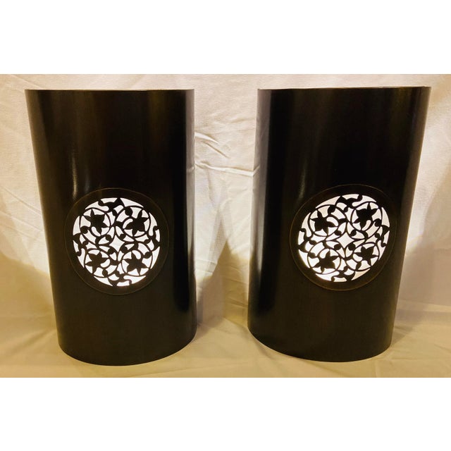 A vintage pair of handmade Moroccan wall sconces or lanterns in Pewter finish. The sconces feature a semi-cylindrical...