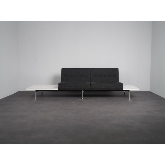 A 1960s two-seater sofa by george nelson for herman miller, part of his modular seating group. The design combines two...