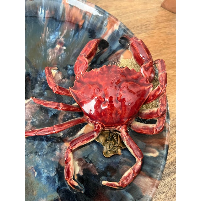The color combination of the glazes used on the base of this platter give the illusion that you are looking down into a...