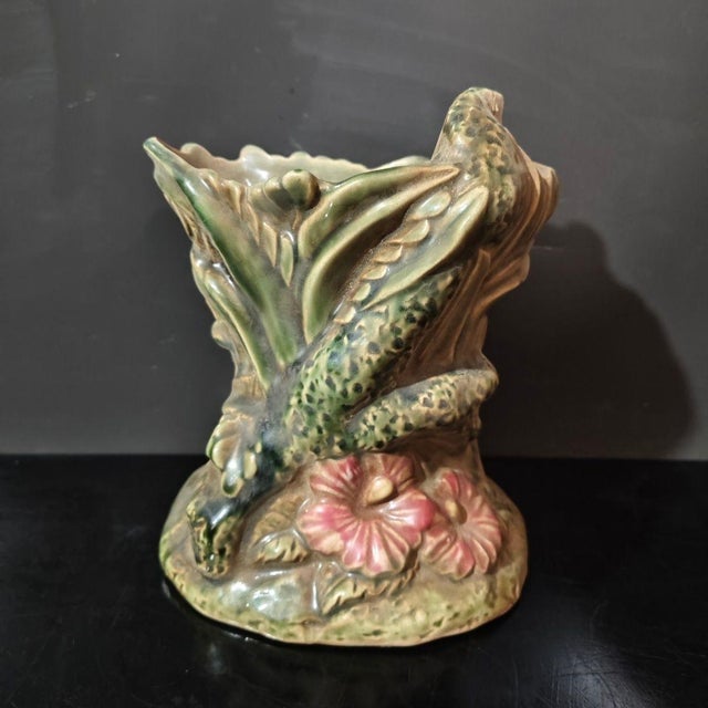 A handcrafted Shiwan pottery brush pot, a classic scholar’s desk accessory from traditional Chinese art. This sculptural...