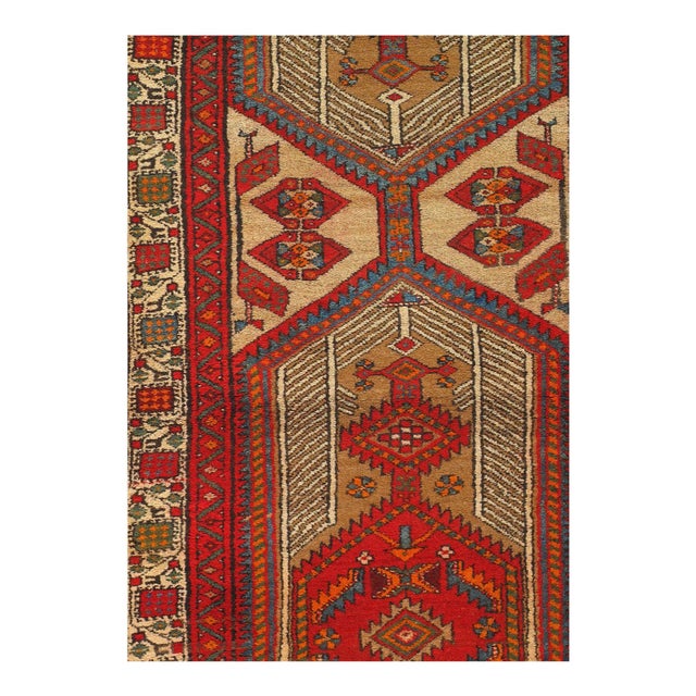 Hand knotted in the village of Serab, northwest Persia in the late 19th century. The rug is made from vegetable dyed wool...