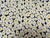 Fabulous vintage Kate Spade all cotton floral tablecloth against the dark background. Bold white Daisy, flowers with...