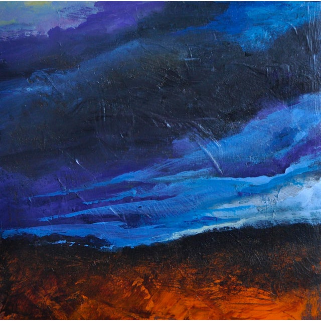 This artwork features a dynamic interplay of deep blues and vibrant oranges, evoking a dramatic sky at twilight. The bold...