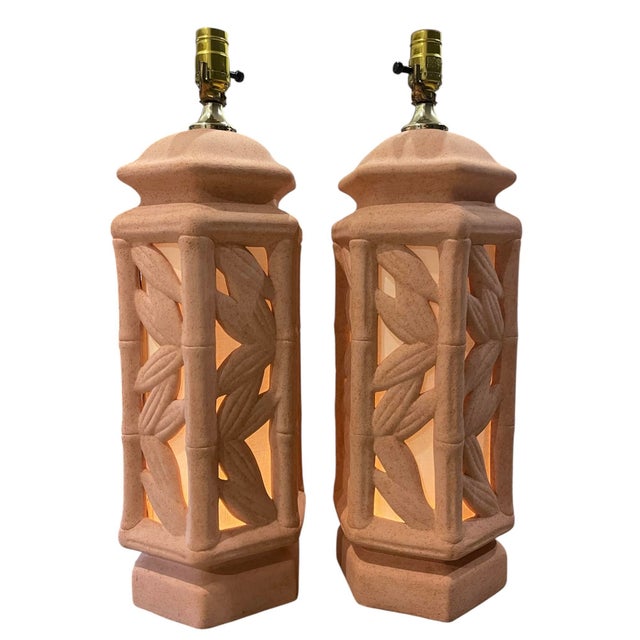 Striking pair of vintage sculptural ceramic table lamps featuring faux bamboo column detailing with carved botanical...