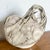 This unique vintage vase, crafted by artist Gail Markiewicz, is a stunning example of textured pottery. Featuring an...