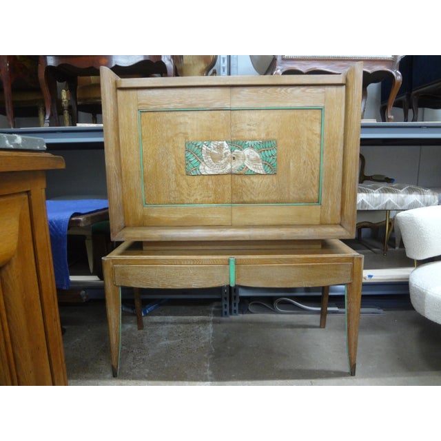 Pair Of French Modern Cerused Oak Cabinets Attributed To Jules Leleu. This rare pair of French Art Deco cerused carved and...