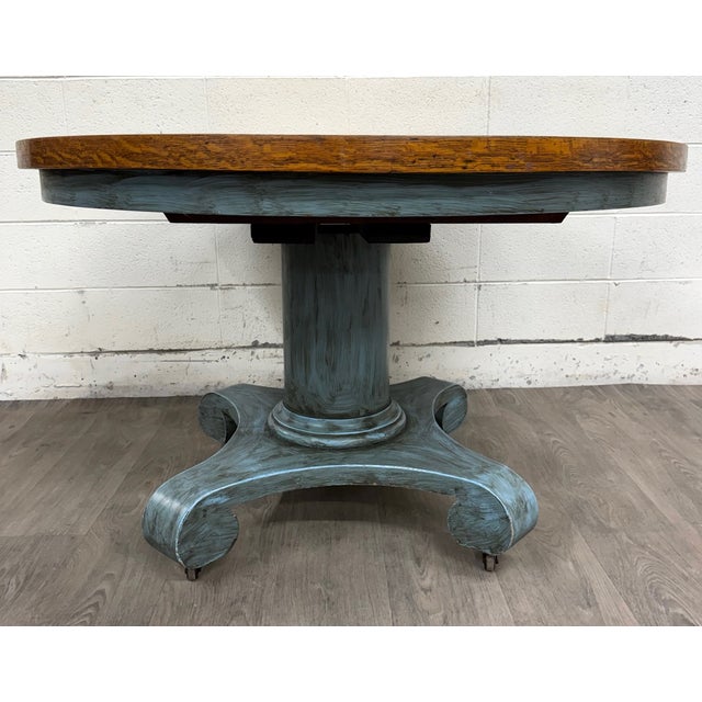 This is a beautiful antique 48 inch tiger oak round pedestal dining table in an American Empire or Mission Arts and Crafts...