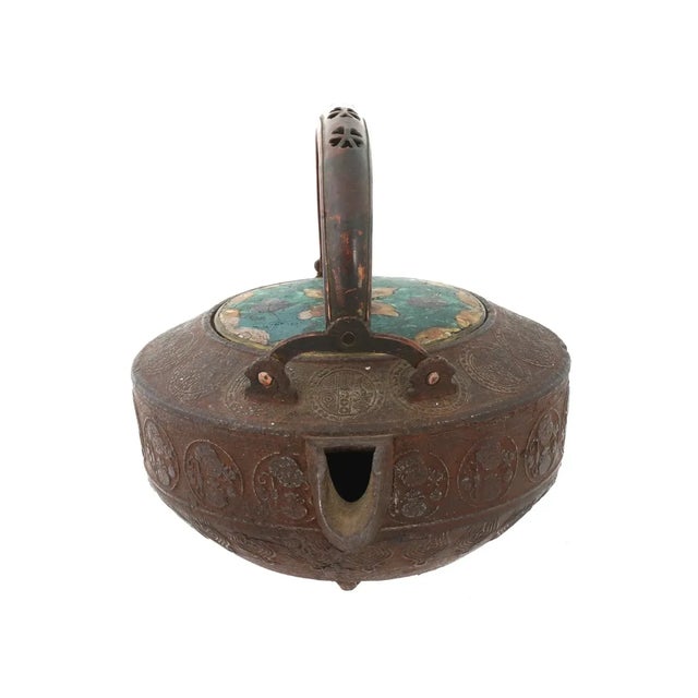 An antique Japanese Meiji Era lidded copper tea pot. Circa: late 18th century to early 19th century. The body of the ware...