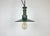 Industrial green enamel pendant light made in Poland during the 1960s. White enamel inside the shade. Green cast aluminium...